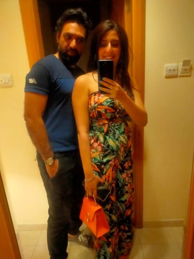 mirror selfie, tropical dress, orange bag