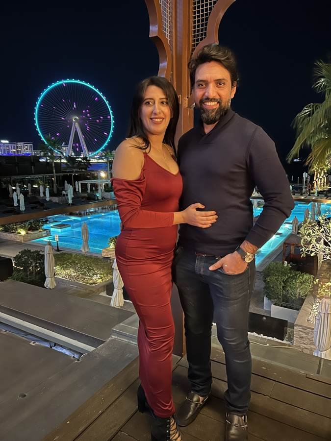 red dress, Ain Dubai glowing behind